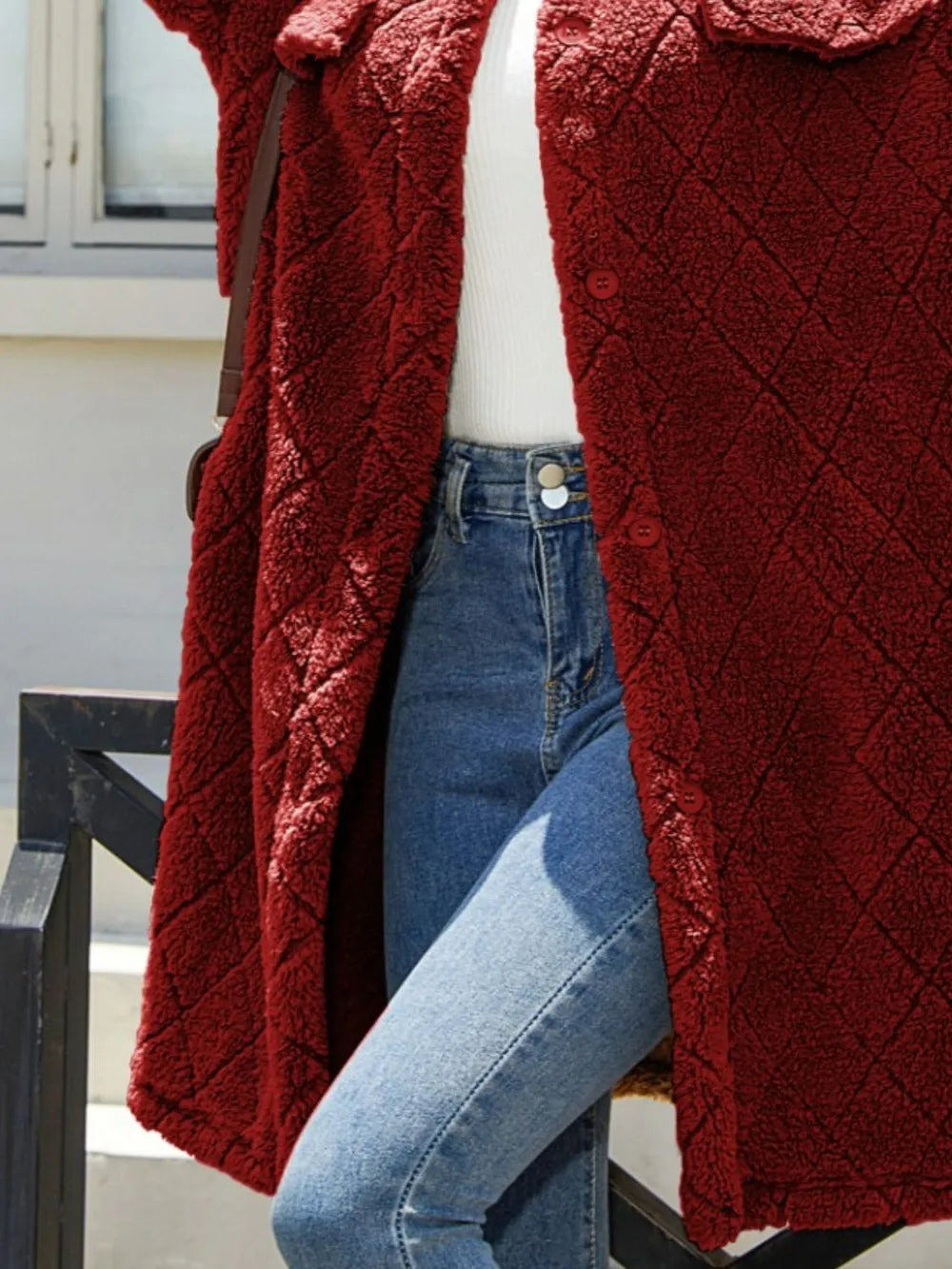 Texture button-up coat in burgundy, featuring a dropped shoulder design, styled with high-waisted jeans.