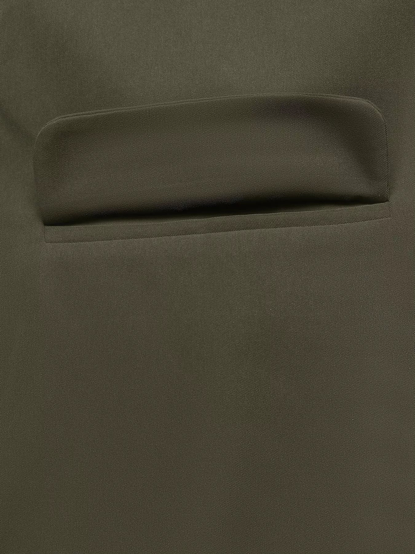 Close-up of pocket detail on a contrast collar button-up coat, showcasing smooth polyester fabric.