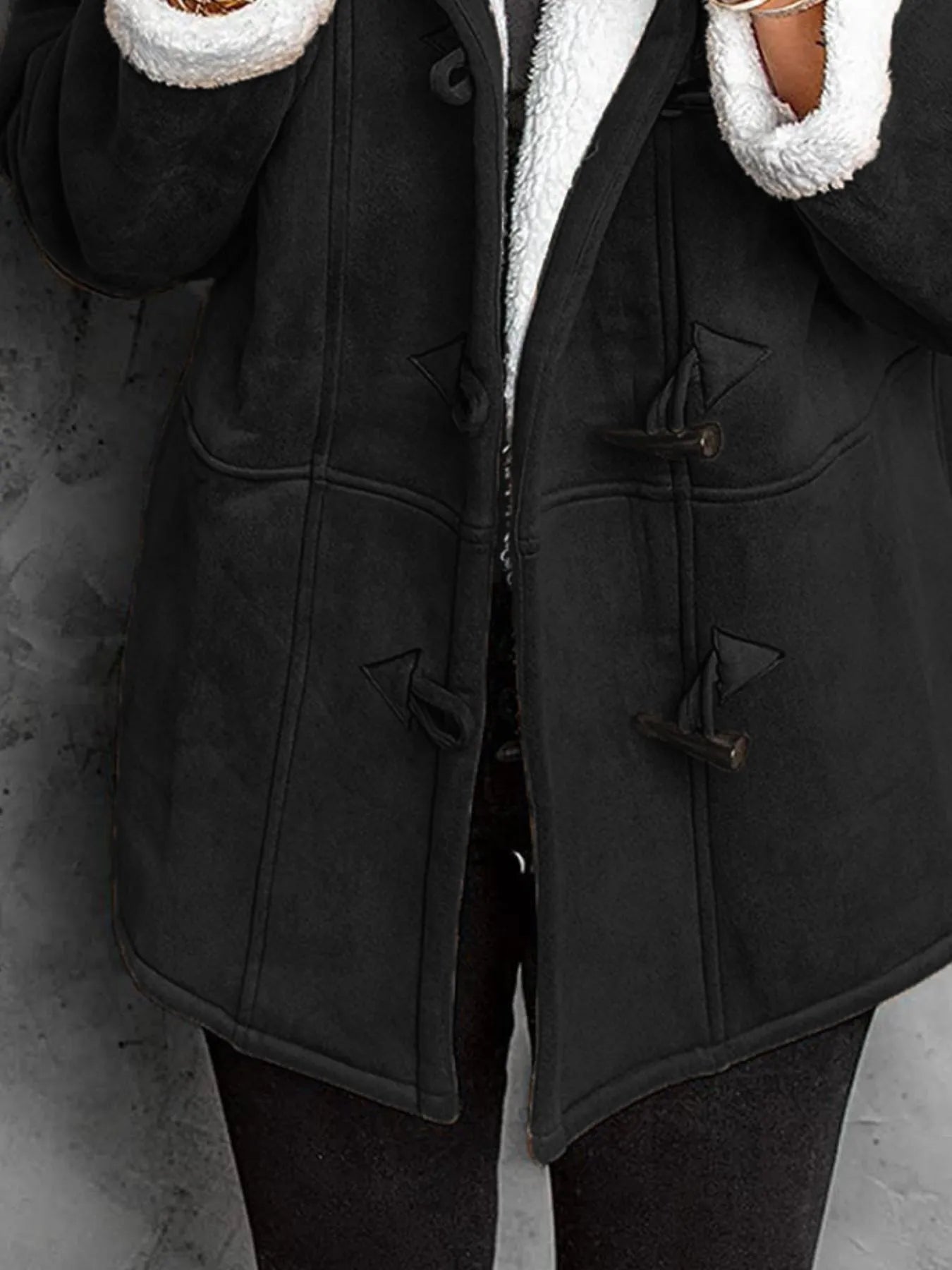 Plus size cozy black sherpa lined toggle coat with hood, perfect for chilly weather.