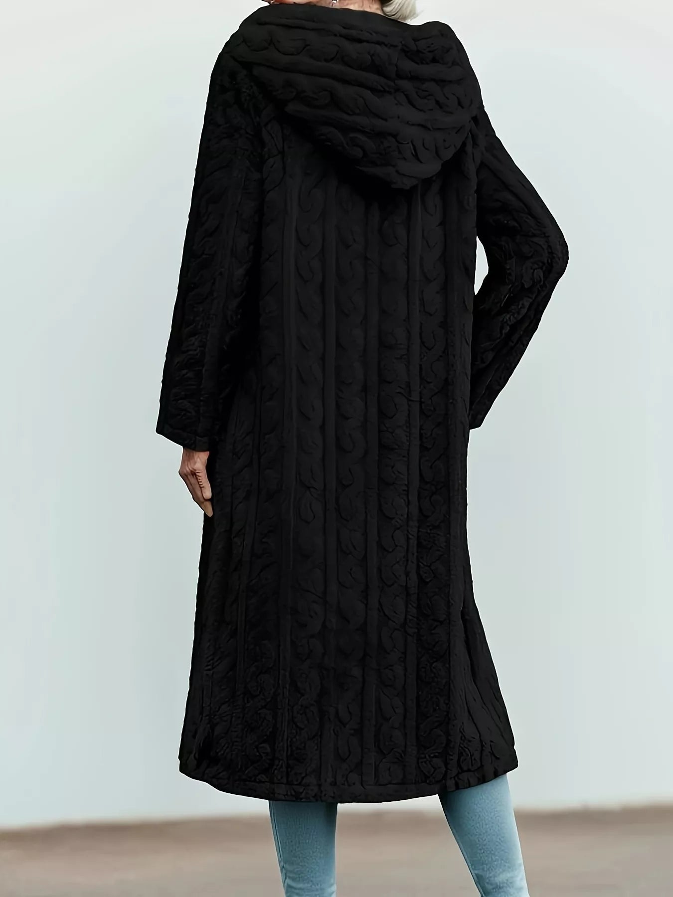 Back view of a black Sherpa longline hooded coat with a textured design and relaxed fit.
