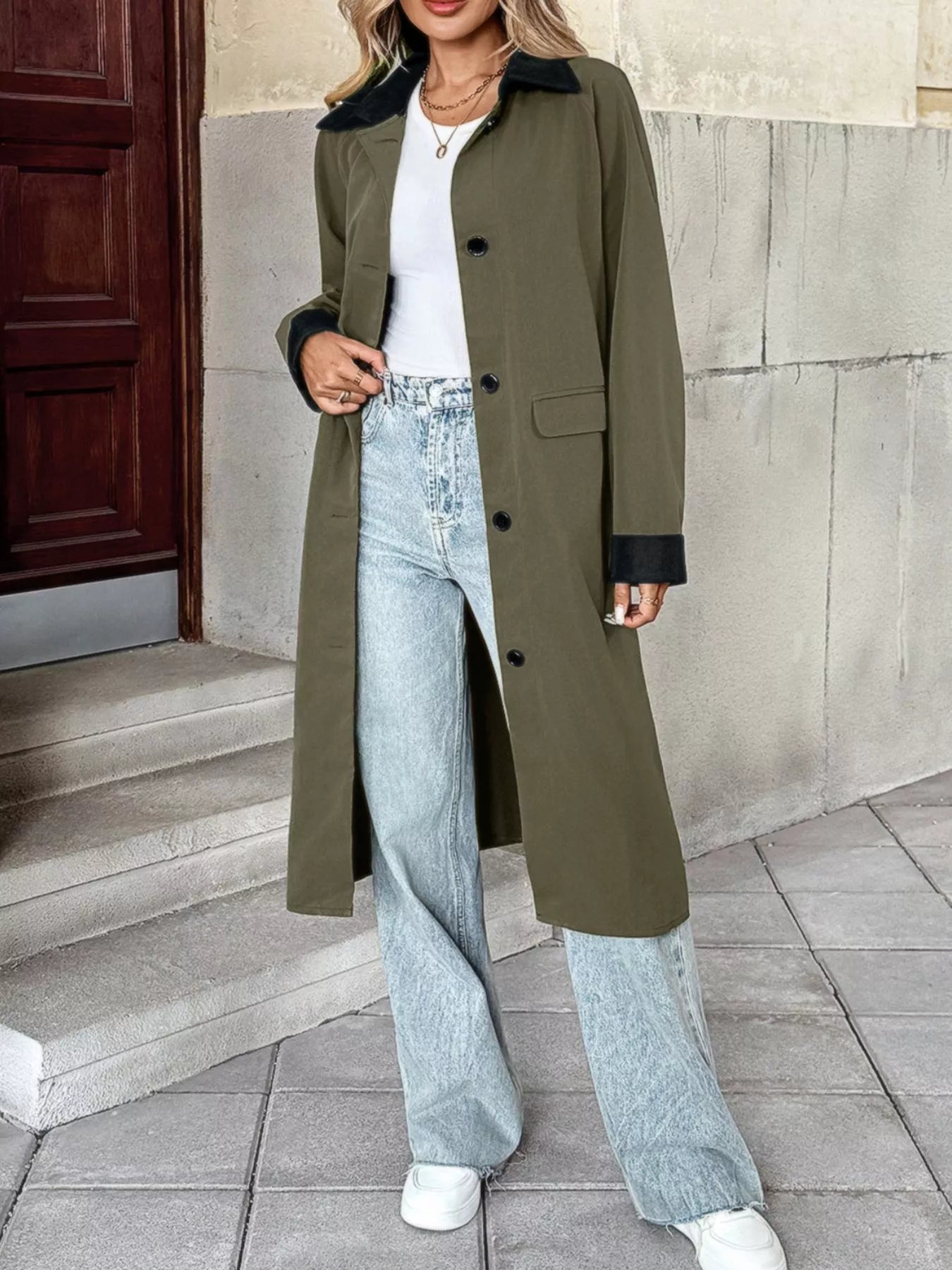 Contrast collar button up coat styled with a white top and light jeans, showcasing a trendy look.