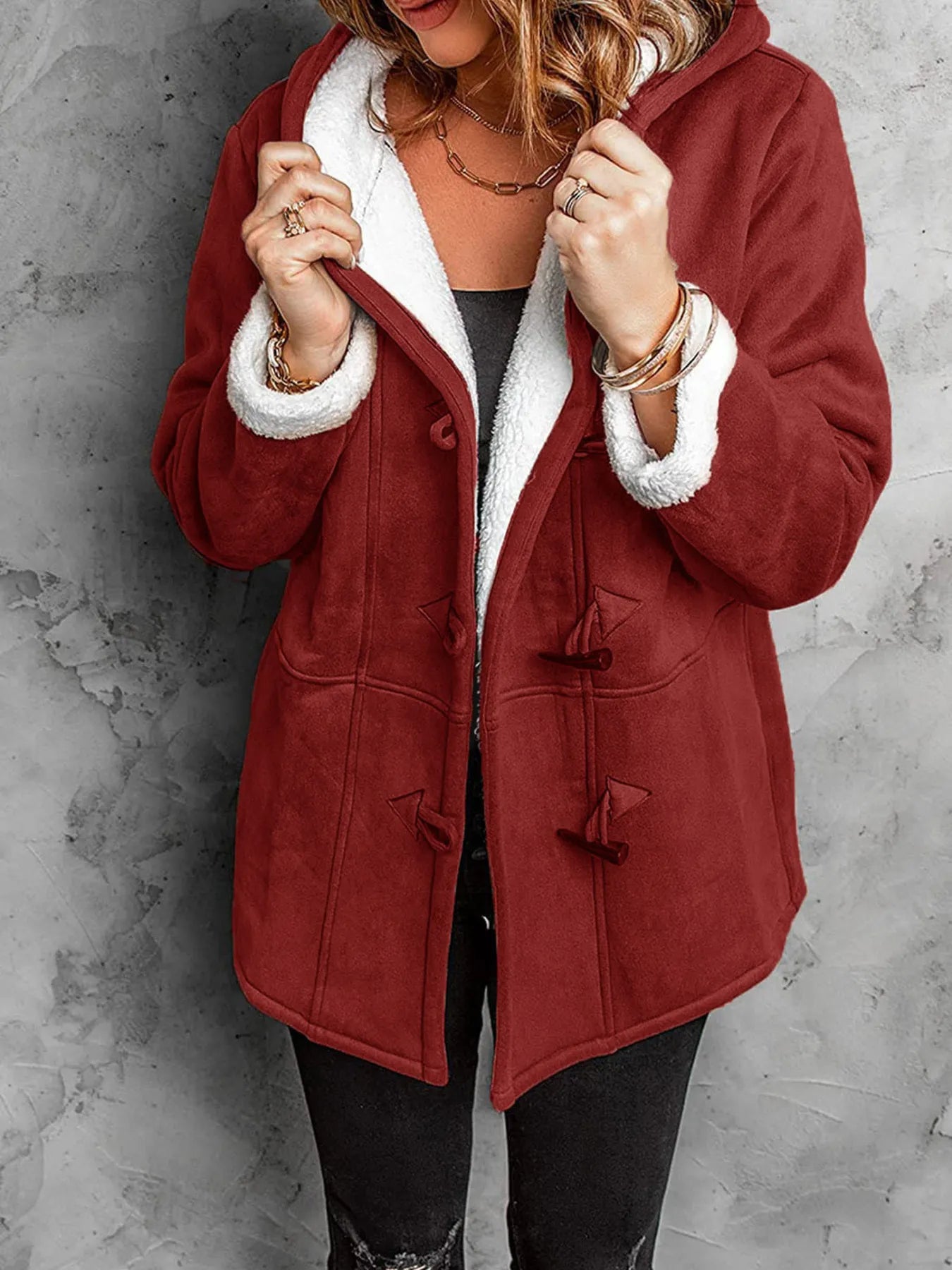 Cozy full size maroon sherpa lined toggle coat with hood, perfect for layering in cold weather.