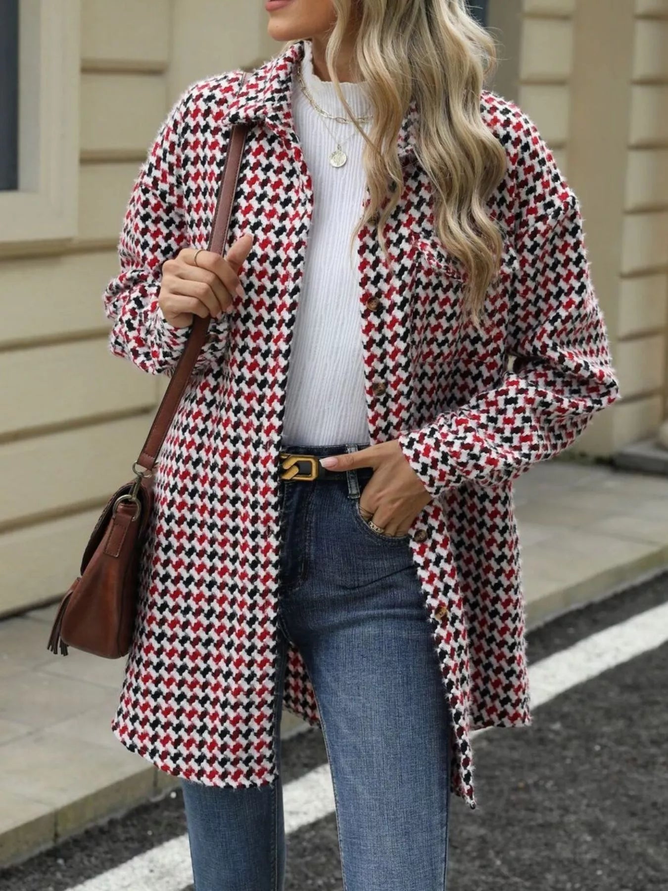 Houndstooth button-up long sleeve coat with pockets, styled with denim and a white top, showcasing a classic look.