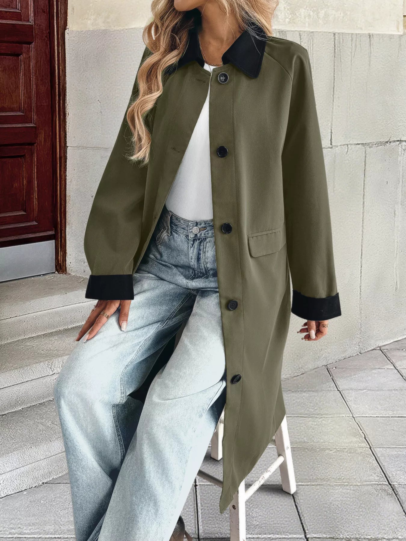 Contrast collar button-up coat featuring a front pocket, styled with loose jeans and a white top.