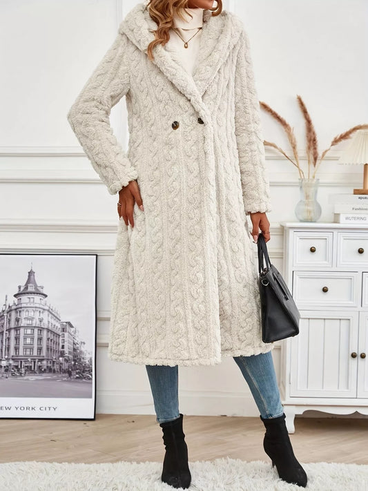 Model wearing a Sherpa Longline Hooded Coat in cream, styled with jeans and a handbag, showcasing its thick, cozy material.