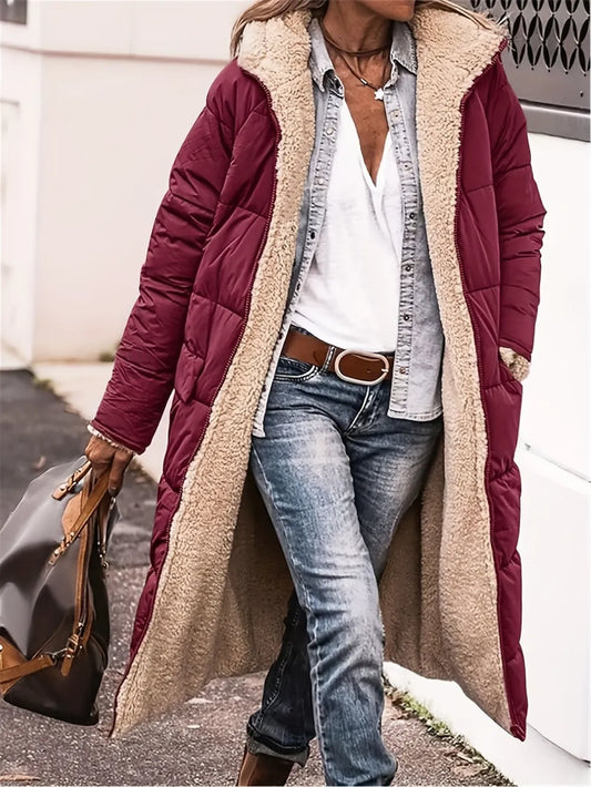 Woman wearing a full-size zip-up sherpa hooded coat in burgundy, styled with jeans and a casual top.